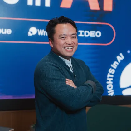 swyx with arms folded at Thursday Nights in AI